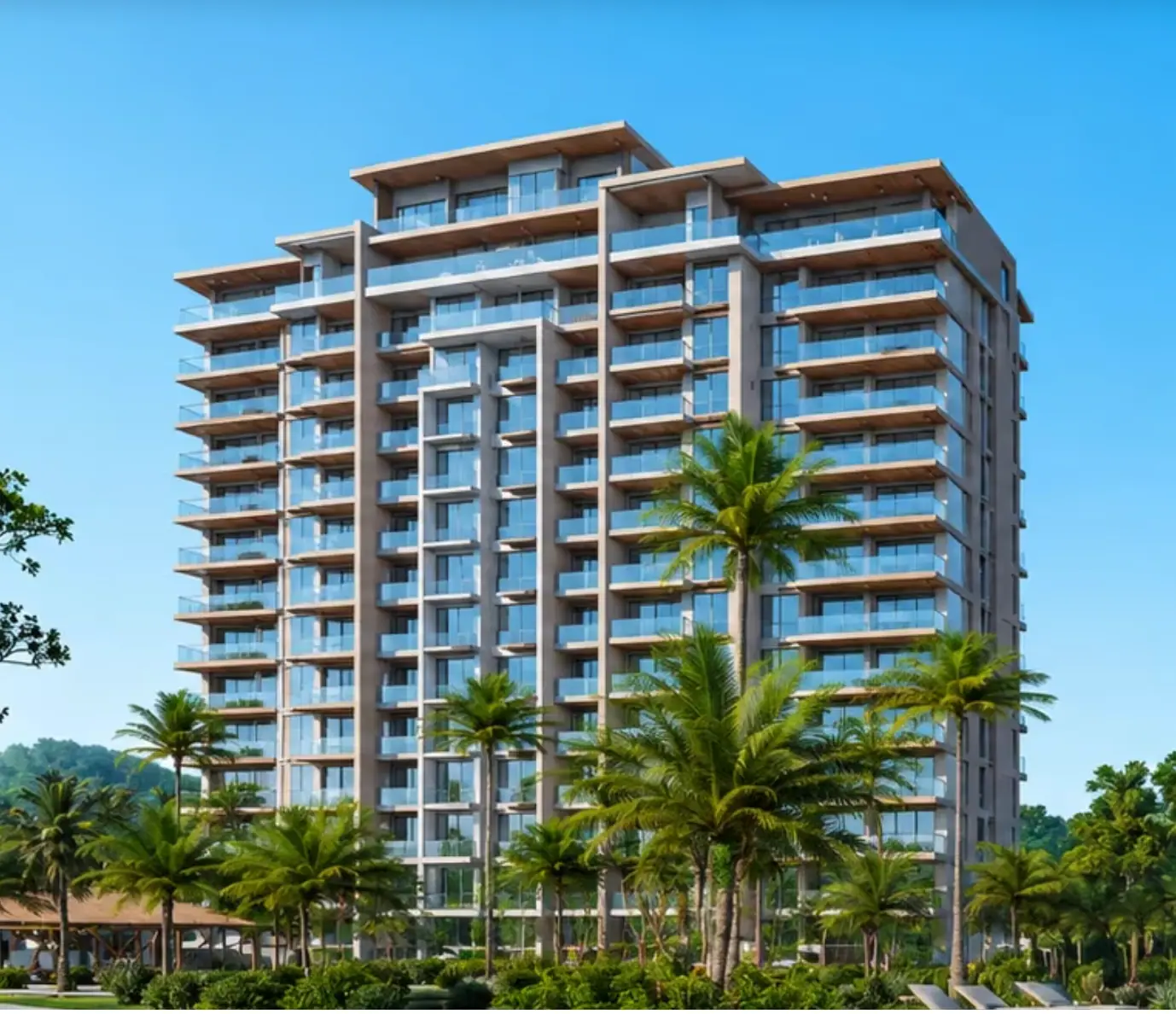 Modern beachfront condominium tower framed by palm trees